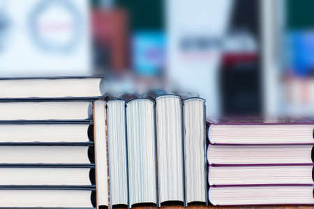 Stack of new books on the table. Books on the forum of manufacturers of printed products.の写真素材
