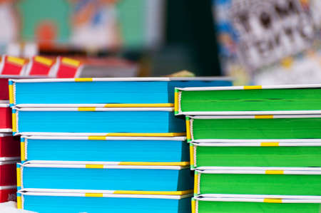 Stack of new books on the table. Books on the forum of manufacturers of printed products.の写真素材