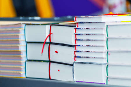 Stack of new books on the table. Books on the forum of manufacturers of printed products.の写真素材