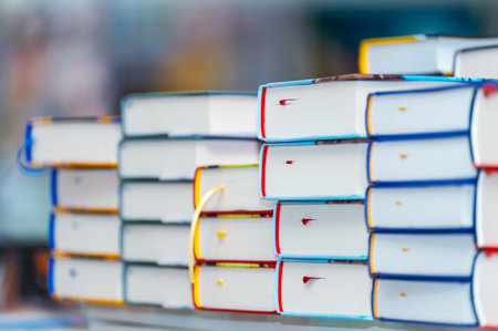 Stack of new books on the table. Books on the forum of manufacturers of printed products.の写真素材