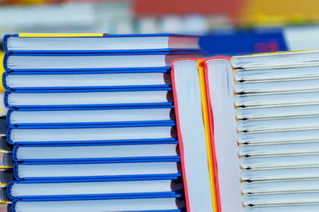 Stack of new books on the table. Books on the forum of manufacturers of printed products.の写真素材