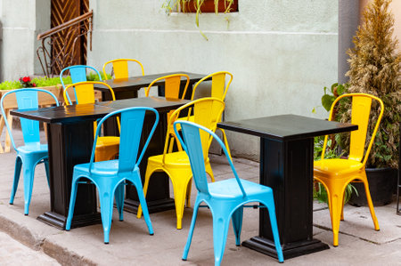 Outdoor cafe in the old town. Chairs and table on empty terrace at cafe.の写真素材