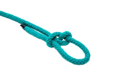 Knot on a cord close-up, isolated on a white background.の写真素材