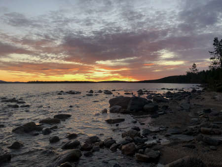 beautiful sunset in the North of Russia outside the city on the lakeの写真素材