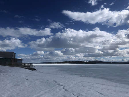 winter frozen lake in the Russian Outback on a Sunny day in springの写真素材