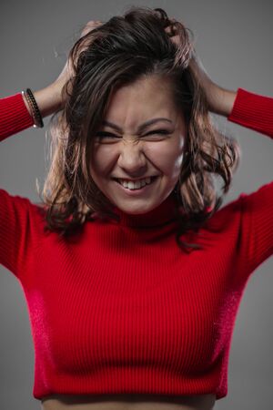 asian girl fooling around on cameraの写真素材