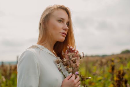 Portrait of a cute pensive elf who looks up.の写真素材