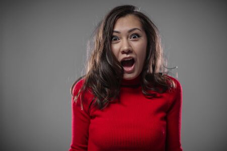 The girl screams with delight.