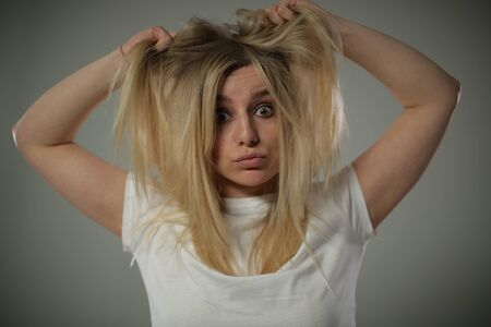 Cute girl with a crazy look shaggy hair.の写真素材