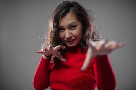 Beautiful Asian imitates a predator.の写真素材