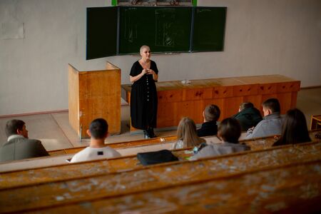 The teacher gives a lecture in the classroomの写真素材