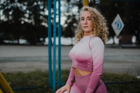 Portrait of a beautiful athlete on the street.の写真素材