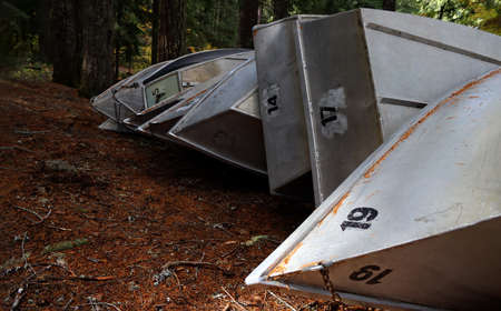 This is a row of row boats lined-up and stacked for winter.の写真素材