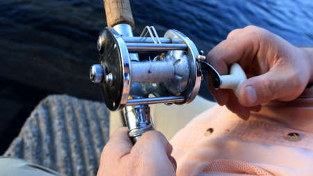 This is an image of demonstrating reeling in fish.