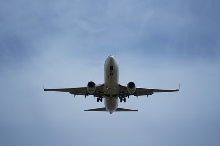Airplane in the cloudy sky.