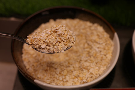 Close up of oatmeal in a bowl with spoon