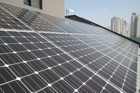 Solar panels installed on the roof of a residential building in the city