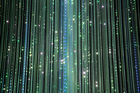 Fiber optics background with lots of light spots and blue and green colors