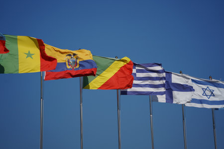 Flags of Ecuador and the Republic of the Congo fluttering in the wind