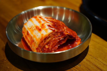 Korean food, Kimchi in a bowl on a wooden tableの写真素材