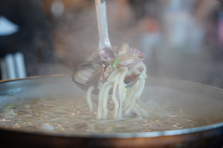 Seafood Kalguksu Noodles with Mixed Seafood, Korean Handmade Noodle Soupの写真素材