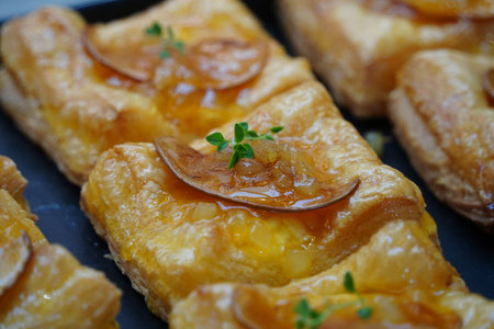 Delicious puff pastry with apricot jam, close-up