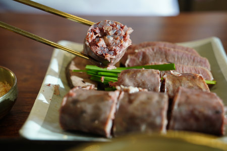 Korean Sausage (Sundae) Slices with Green Onions on Plateの写真素材