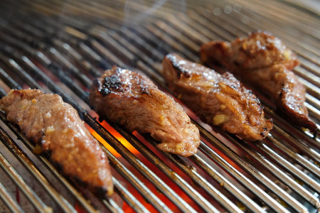 grilled pork on the grill in the restaurant, close-up