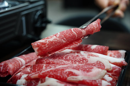 Thinly Sliced Raw Beef for Hot Pot or Shabu-Shabuの写真素材