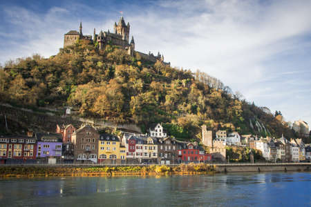 An image of the Mosel River, Cochem's homes and the town's Medieval castle overhead