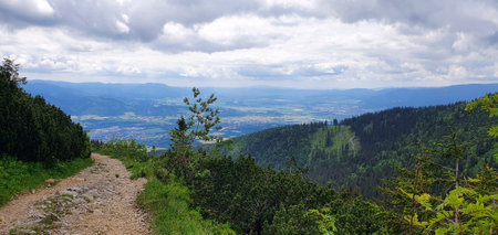 Natural landscape in the foothills of the High Tatras in the north of Slovakia in early summer with wide valleys and green meadows.の写真素材
