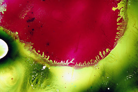 Colored liquids mixed together in fluid creating colorful abstract paintingの写真素材