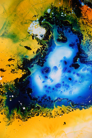 Colored liquids mixed together in fluid creating colorful abstract paintingの写真素材