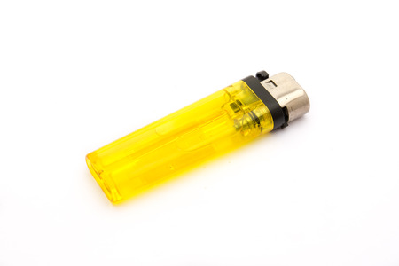 Yellow lighter isolated on white backgroundの写真素材
