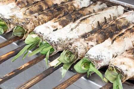 salted grill snakehead fish with herbsの写真素材