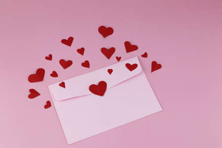 Cut the heart-shaped paper, put on a pink background. Valentine's Day Concepts