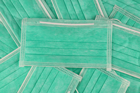 Green face mask, medical masks prevent germs. The coronavirus has a thickness of 3 layers.の写真素材