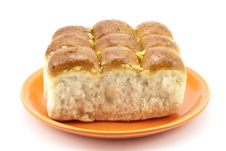 buns and garlic on a plateの写真素材