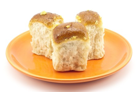 buns and garlic on a plateの写真素材