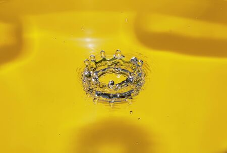 splash of water on a yellow background