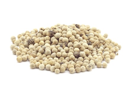 refined white fragrant pepper on a white backgroundの写真素材