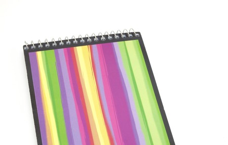 colored notebook with a spring on a white background