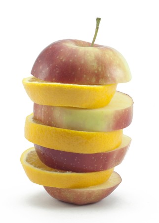 Sliced layers red apple and orange on a white backgroundの写真素材