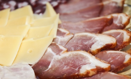 Background of slicing sausage, cheese, and sturgeon for your designの写真素材
