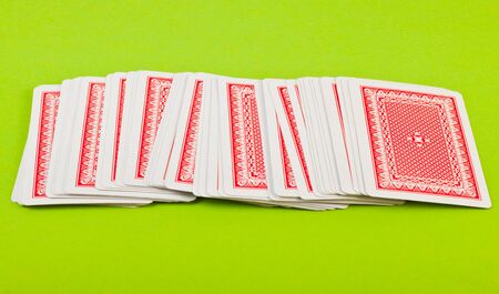 stack of playing cards on green backgroundのeditorial素材