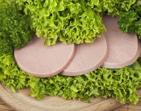 Sausage with parsley and lettuceの写真素材