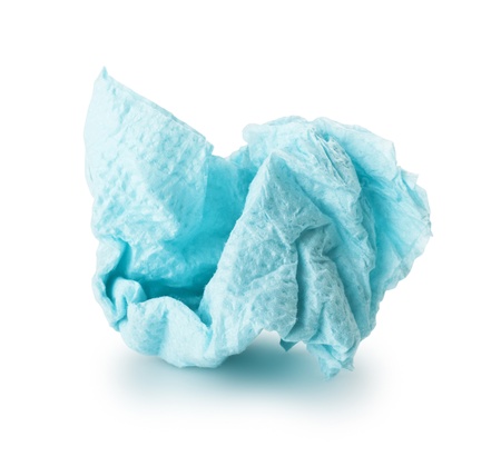 crumpled blue paper napkin on a white backgroundの写真素材