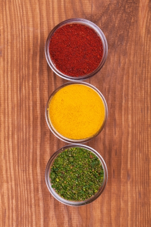 Herbs and Spices over wooden background の写真素材
