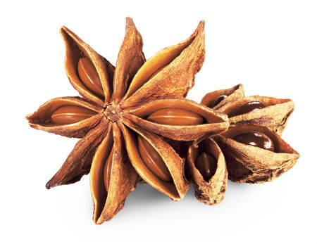 star anise in closeup over white background. Clipping Pathの写真素材