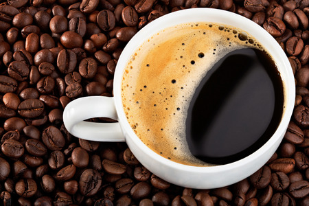 background coffee beans with white cup の写真素材
